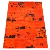 Tapis patchwork en peaux de vache orange