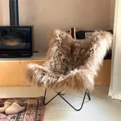 Fauteuil Butterfly AA original en peau de mouton Maison Thuret